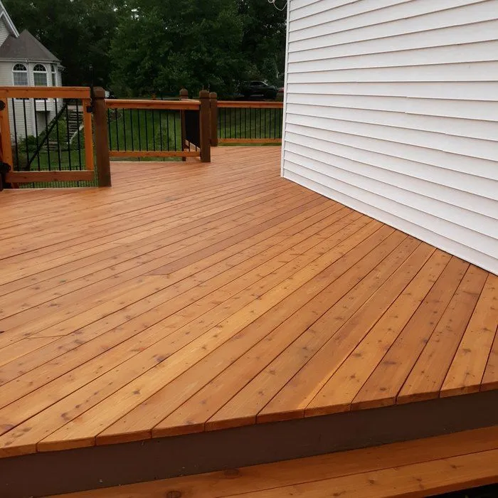 Cedar deck with board replacement and railings